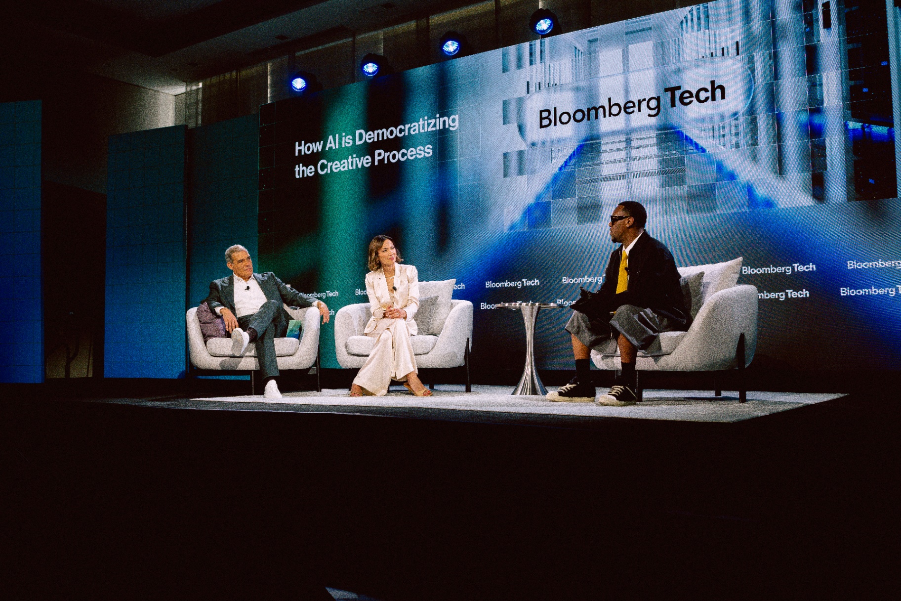 Hit-Boy on stage at Bloomberg Tech 2026 with Emily Chang and Tom Giles, under the session title 'How AI Is Democratizing the Creative Process'